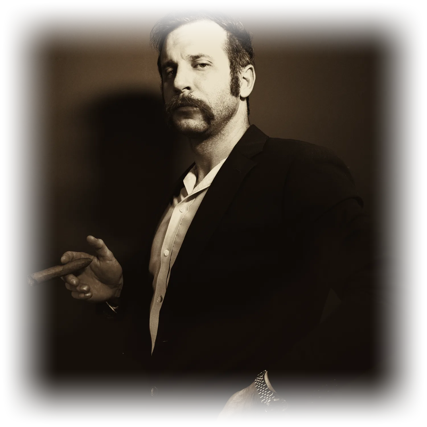 R.B. Barnes, in a dark suit with a cigar, lit from one side